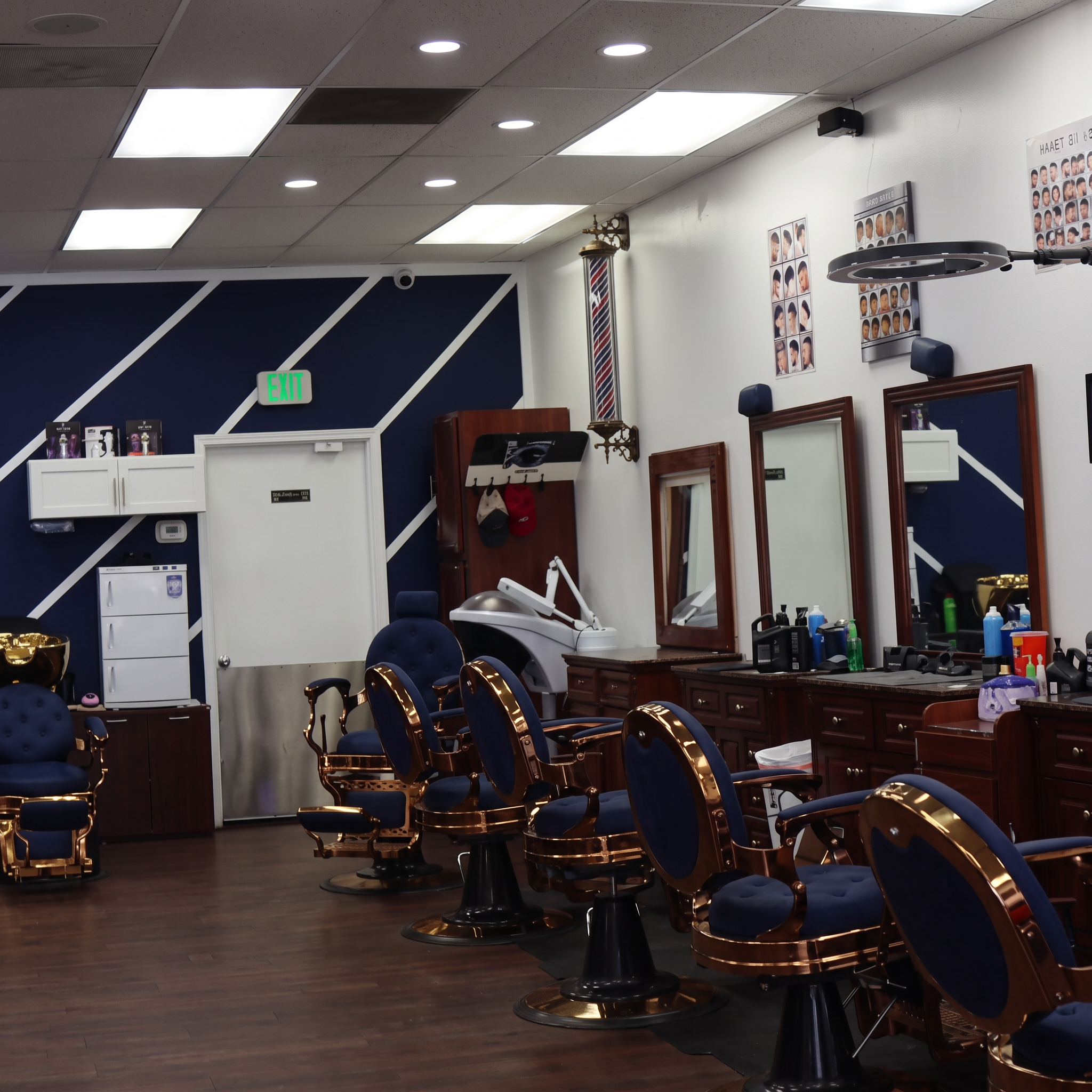 Barber chairs and mirror stations inside Top Trend Barbershop in Monroe, Michigan
